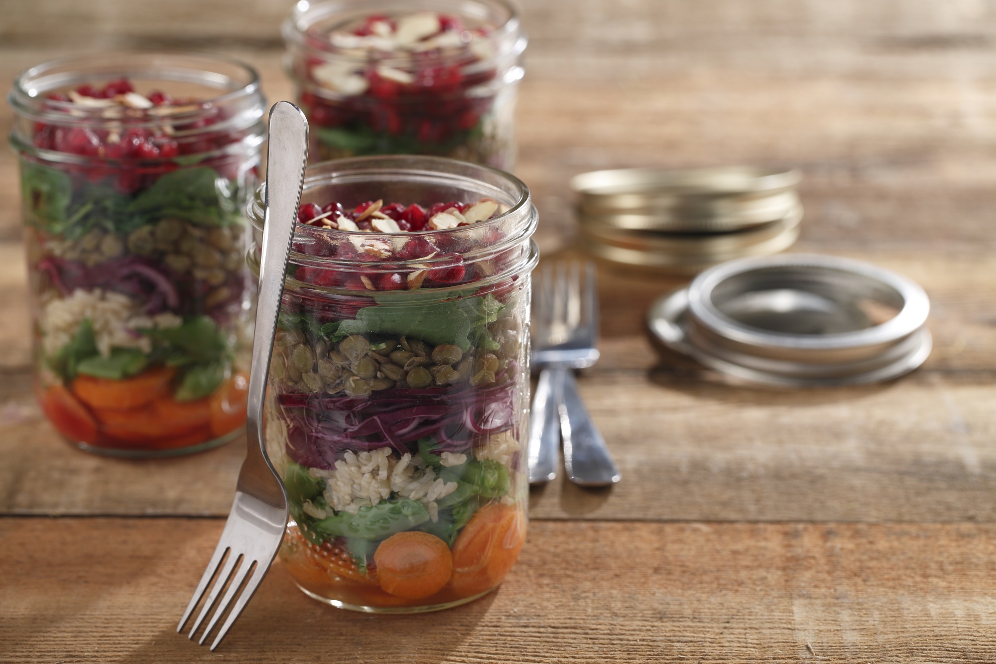 Rainbow salad in a glass jars Stock Photo by ©sarsmis 73088347